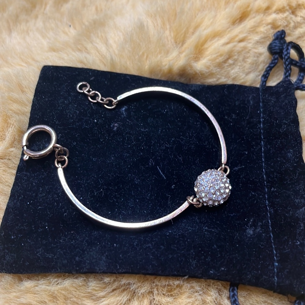 Gold pieced bangled with diamond detailing